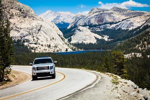Pickup truck driving in mountains