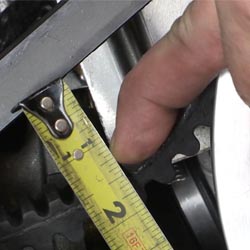 Snowmobile belt deflection