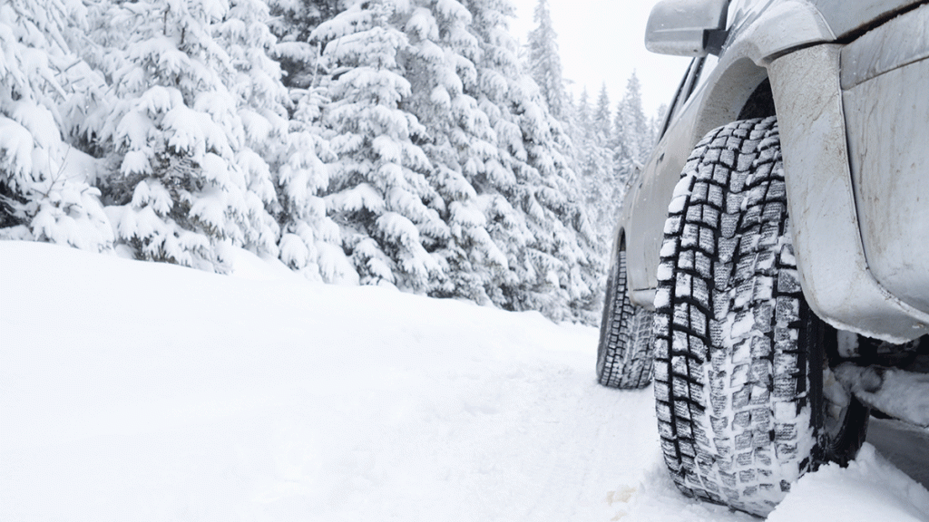 Car driving in snow during winter