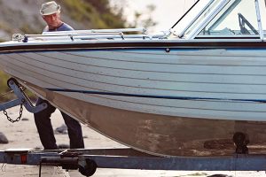 Inspecting boat hull.