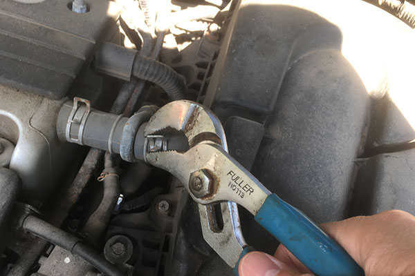 Remove air-intake tube from air filter housing