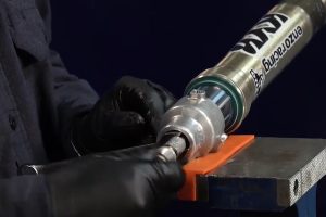 Installing dirt bike fork tube.