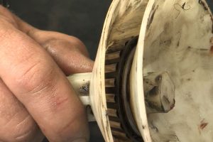 Repack a trailer bearings using a bearing tool.