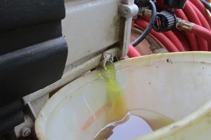 Drain old compressor oil. 