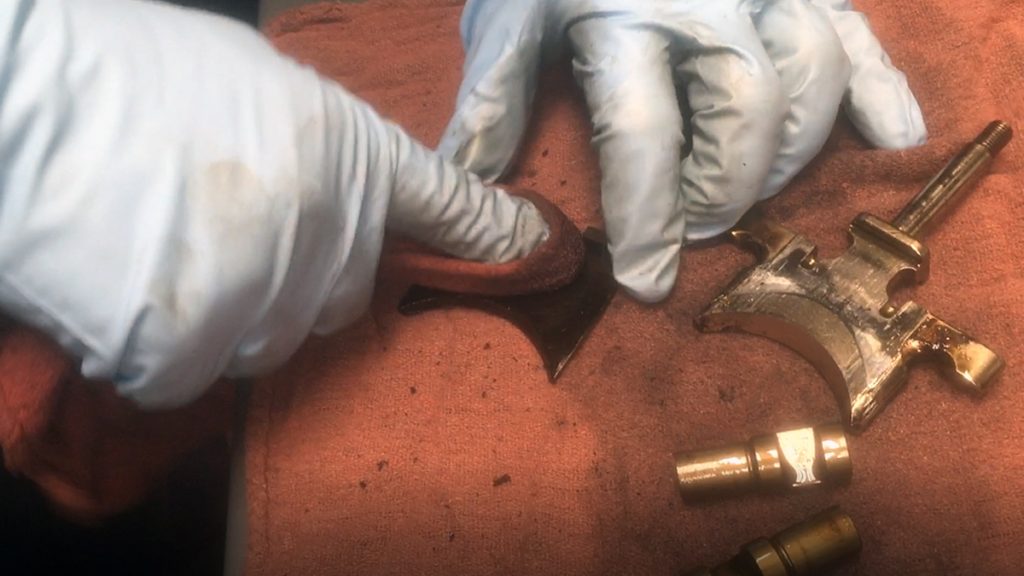Cleaning a snowmobile exhaust power valve